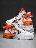 White sneakers with orange and black accents on a dark background