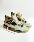 Pair of green and brown sneakers on a white background
