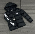 Black puffer jacket with Nike logo on a wooden floor